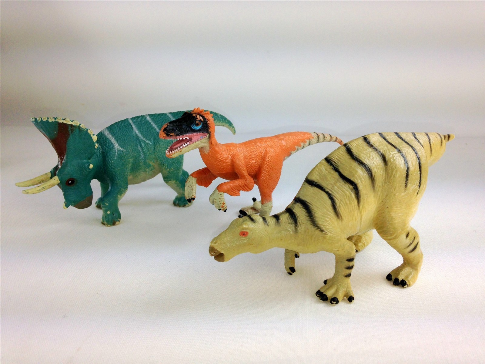 Lot of 17 Hard Rubber Triceratops Tyrannosaurus Iguanodon Velociraptor + more