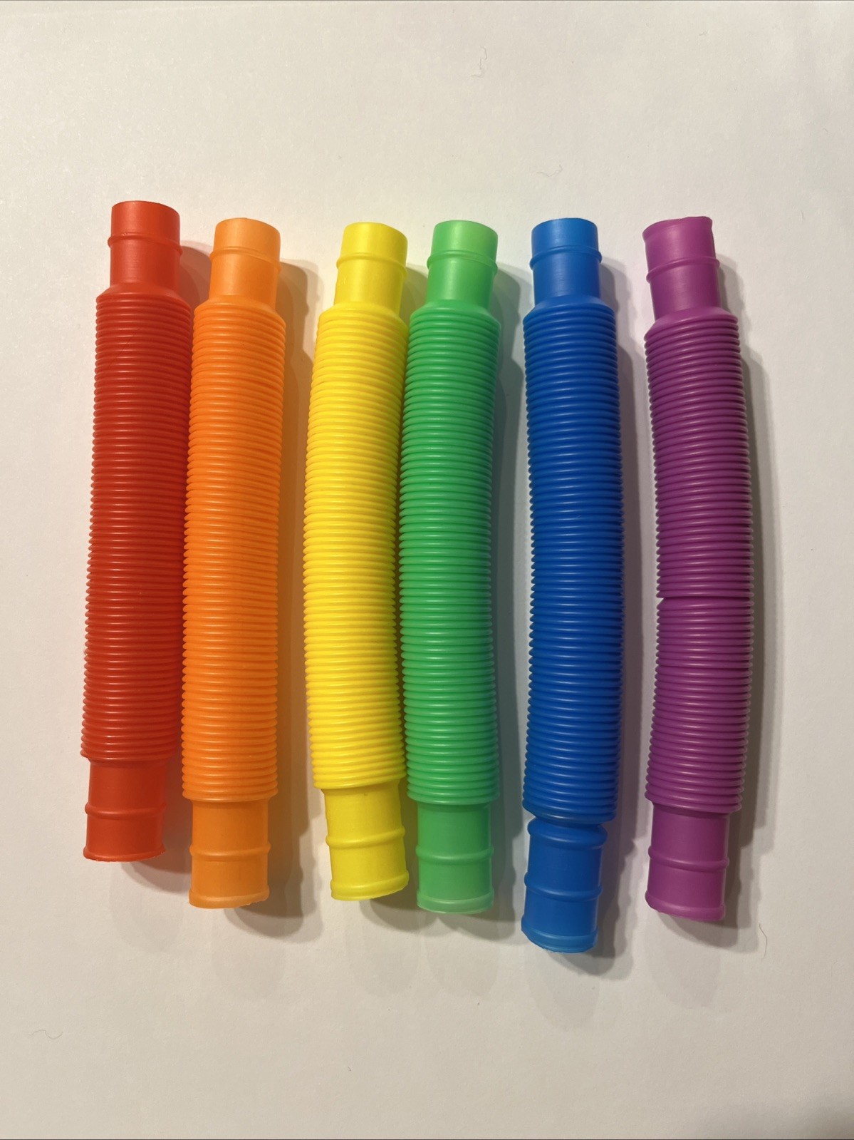 Pack of 5 Rainbow Slinky Pop Tubes