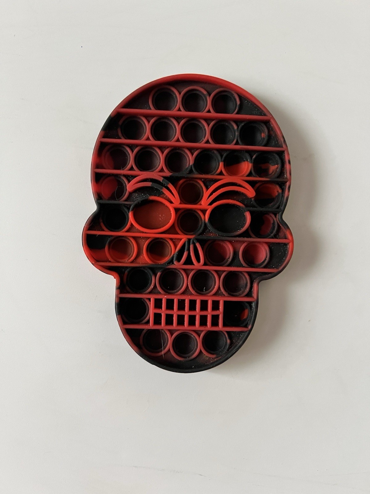Red & Black Skull Head Bubble Popper Toy Stress Relief Fidget Toy