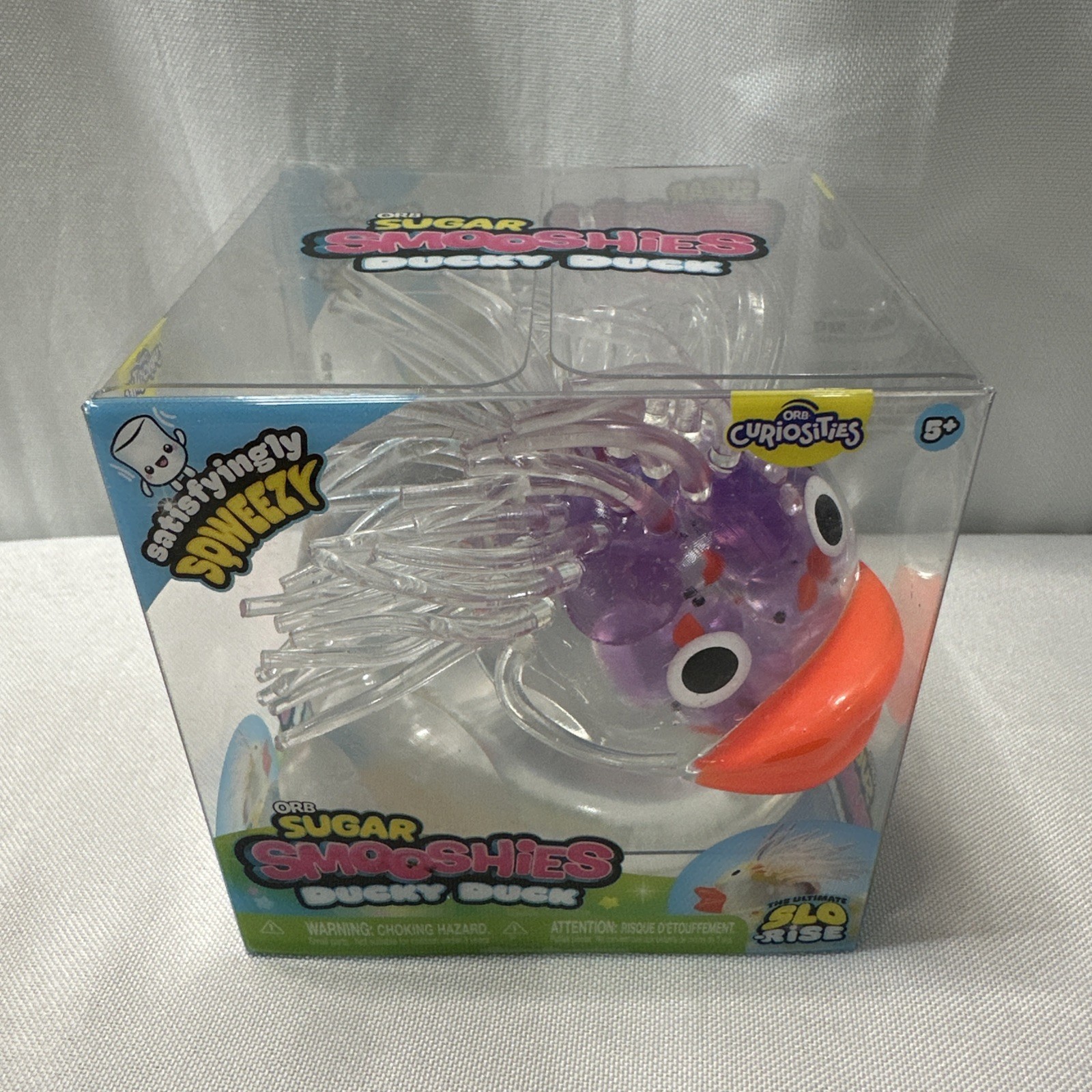 ORB SMOOSHIES Ducky Duck Slo-Rise Tactile Squeeze Toy Purple Orange Clear