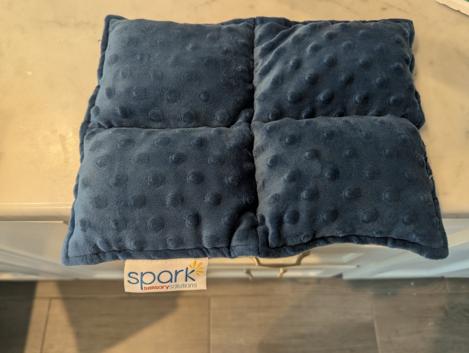 Weighted lap pad