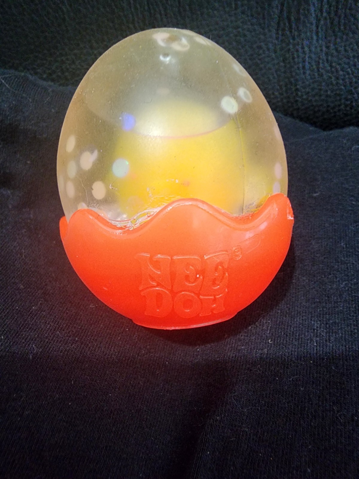 Schylling Needoh Squeezer Egg Squish N’ Flow Squeeze Egg Orange/clear/white