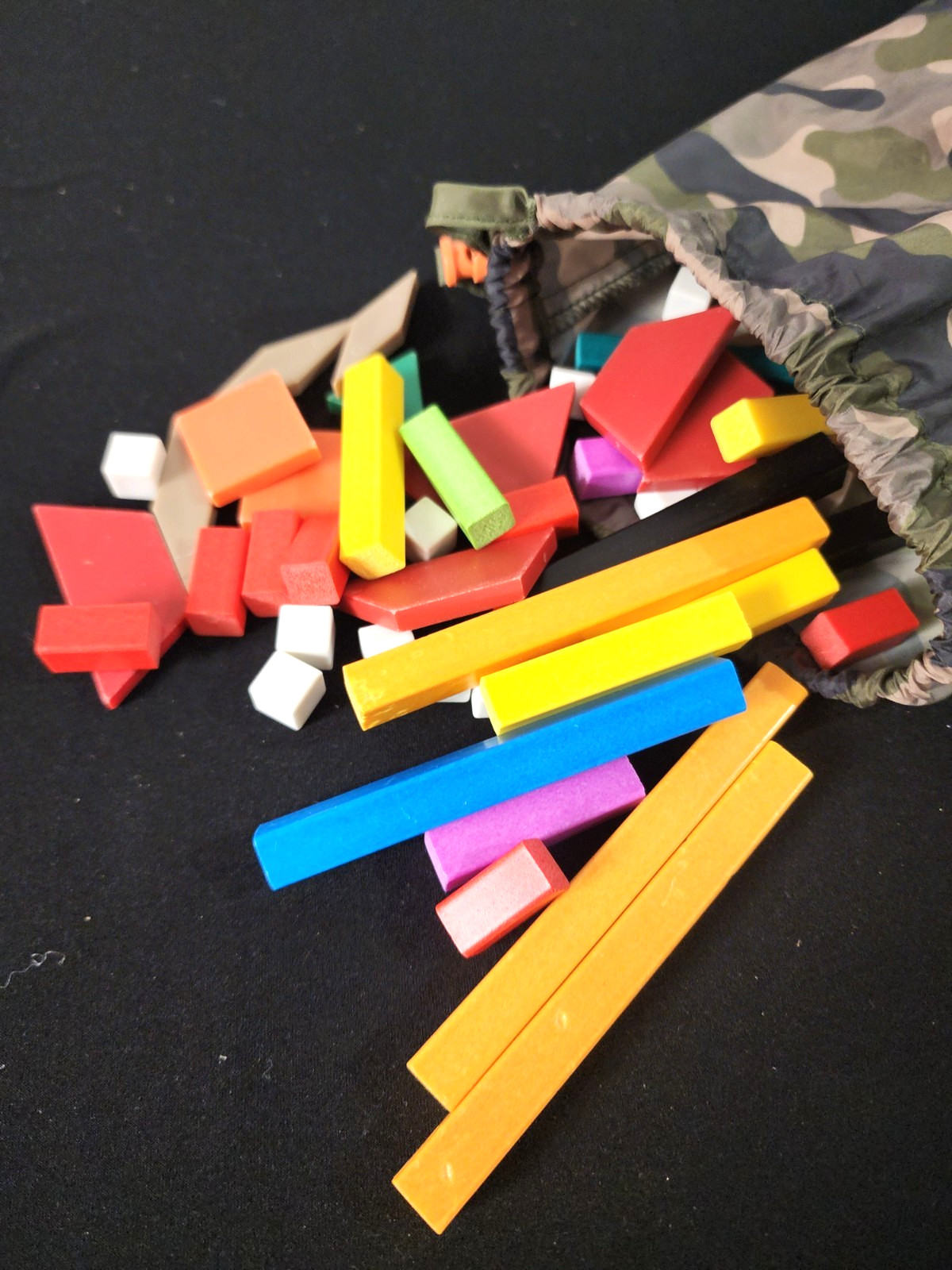 Mixed Lot of 78 Tangram pieces and 102 Cuisenaire rods in camo dino bag